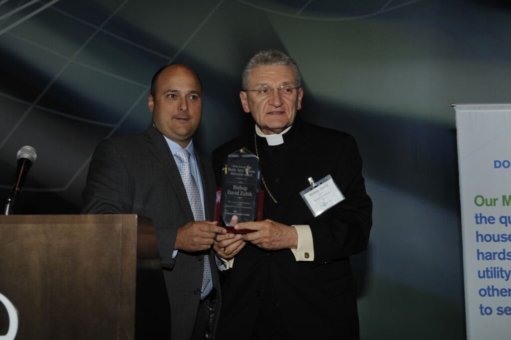Dollar Energy Fund CEO Chad Quinn presents Bishop David Zubik with the Betty Ann Simon Award