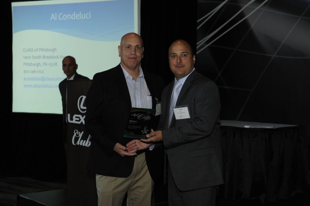 Chad Quinn presents the 2015 Golden Eagle Award to Sarris Candies. 
