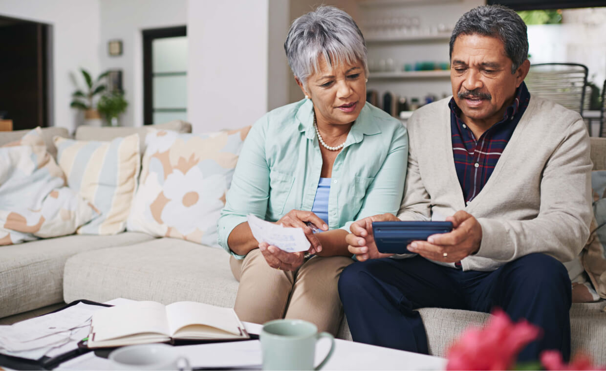 elderly-couple-working-out-a-budget-min